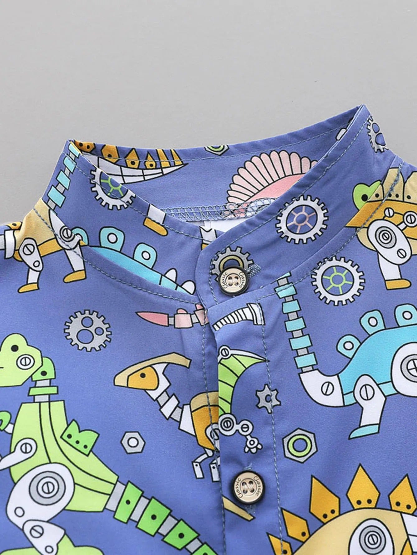 2PCS Toddler Summer Outfit - Dinosaur Print Short-Sleeve Shirt with Standing Collar and Matching Shorts.